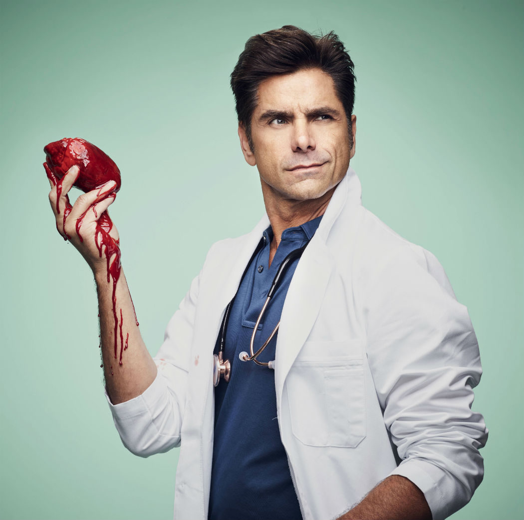 John Stamos como el Dr. Brock Holt